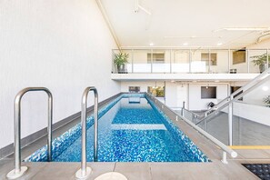 Guests can cool down with a refreshing dip in the building’s shared pool. 