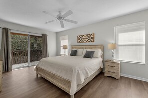 Rest easy in this tranquil bedroom with plush bedding and soft lighting, ensuring a restful night's sleep.