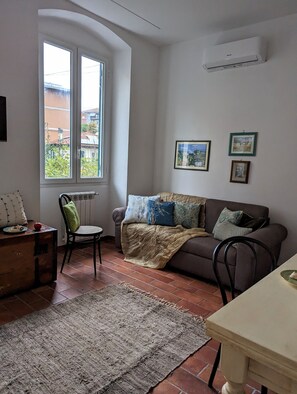 The sofa sleeper in the kitchen/living room accommodates two people.