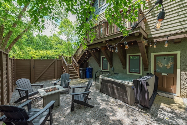 Cozy up around the fire table & soak your worries away in the hot tub on the private patio at Cheshire Cottage!