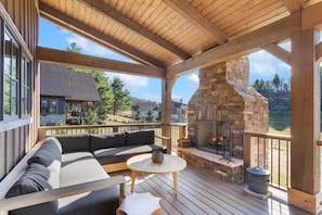 Covered Living Area with a Wood-burning Fireplace