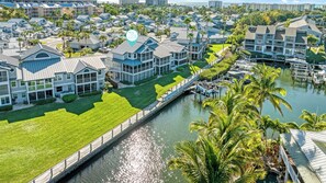 Aerial view of waterfront with boat access.  Unit indicated.