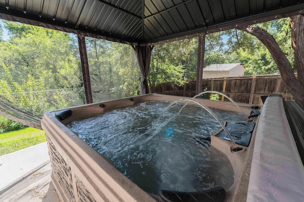 Enjoy a soak in the hot tub.