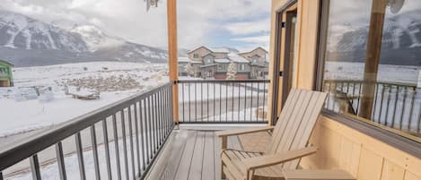 The home is surrounded by mountains.