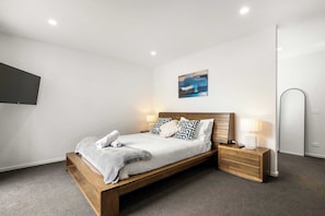 Main bedroom - complete with walk-in robe, ensuite and access to the backyard.