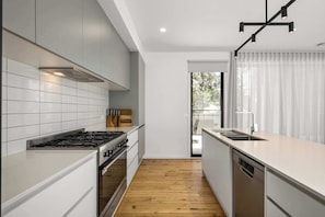 Fully-equipped kitchen with new and premium appliances.