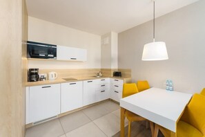 The fully equipped kitchenette includes everything you need for a home-cooked meal.