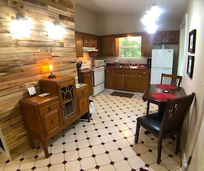 Full kitchen with dining area.