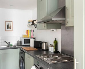 Save money and eat in! Kitchen with hob, oven, dishwasher, microwave, fridge freezer, Nespresso coffee machine - and cook books!