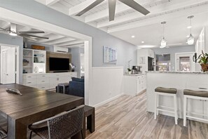 Open concept living, kitchen and dining areas.