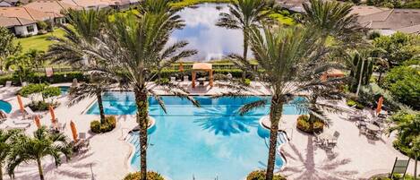 Unwind by the resort-style pool, surrounded by lush landscaping and luxurious loungers. The pool area is a picturesque oasis where you can bask in the Florida sun or take a refreshing dip to escape the heat.