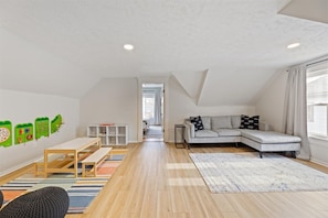 A cozy corner just for kids - toys, games, and space to play while parents relax