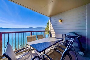 Private balcony with electric BBQ and dining table.