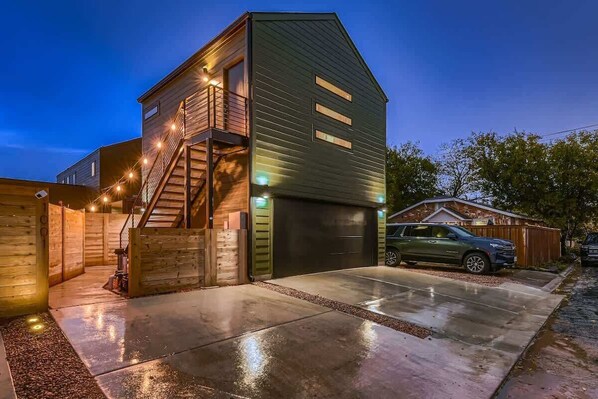 Exterior with own parking space and private entry up the stairs
