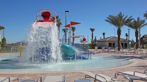 Resort Amenities - Adorable kiddie splash pool, offering a safe and playful water experience for the little ones to enjoy