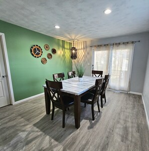 Spacious dining room with sturdy dining table and chairs