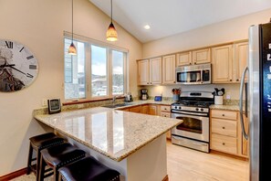 Gorgeous Custom Granite Countertops in a Fully Stocked Chefs Kitchen