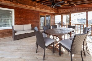 Dine al fresco on the the screened in porch with seating for 8 at the table.