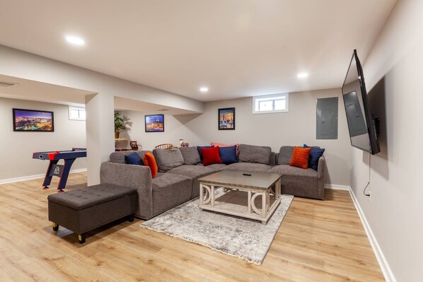 The lower level recreation room is the perfect place to watch the games or play games.