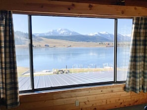 Wake up to stunning lake vistas from the master bedroom at Henry's Hatch Cabin, offering a serene retreat with unparalleled views, ensuring every morning begins with tranquility and beauty.