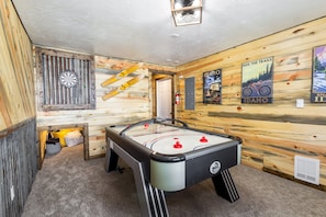 This house offers a fantastic Game Room with air hockey and a magnetic dart board for indoor fun!
