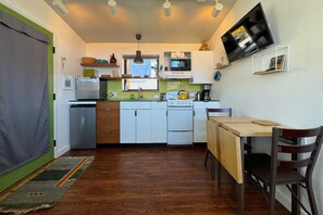 The well-appointed kitchen comes equipped with a range, fridge, dishwasher, kettle, coffee maker, and loads of other cookware.