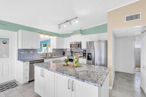 NEWLY RENOVATED fully stocked kitchen where you can make your favorite homecooked meals even while on vacation!