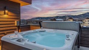 Enjoy soaking in the private rooftop hot tub