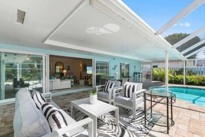 Enjoy a cocktail and time in the sun on the screened lanai 