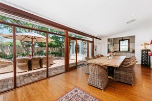 The dining room flows out to the courtyard, creating a seamless transition between the indoors and out.