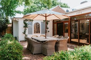 Dine alfresco in the verdant private courtyard, relishing the crisp country air.
