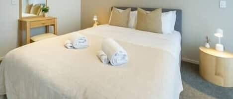 Bedroom with spacious Queen bed and hotel quality linen