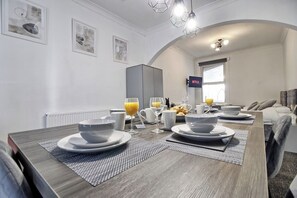Dine together in the spacious multipurpose living space.