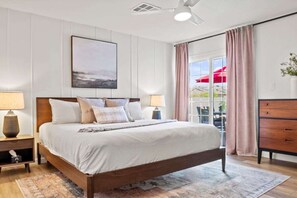 View of the master bedroom showcasing the direct access to outdoor spaces, blending indoor comfort with outdoor serenity.
