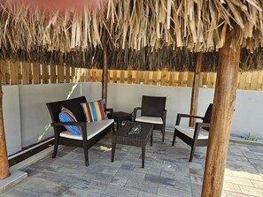 Cool palapa with full set of patio furniture