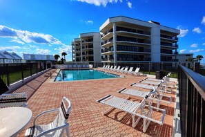 Beautiful pool with lots and lots of lounge chairs