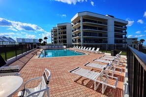 Beautiful pool with lots and lots of lounge chairs