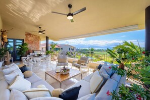 Spacious Balcony with Oversized Sectional, Seating for Dining, and Propane Grill