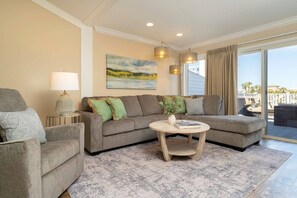 Amazing Living Area - (1) Sectional Chaise Couch, (1) Recliners, Coffee Table for Games, Flat Screen TV, (2) Sliders Leading to Upper Level Deck