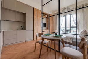 The dining area is combined with the kitchen, everything is at hand.