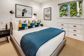 Primary bedroom with comfortable queen size bed and luxury linens professionally laundered and pressed