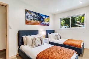 Third bedroom with twin beds and luxury linens that are professionally laundered and pressed