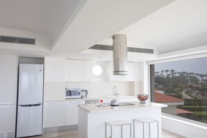 Kitchen with island and extra seating for 2 people