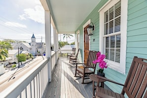 Second Floor Balcony with Partial Duval Street and Lighthouse Views