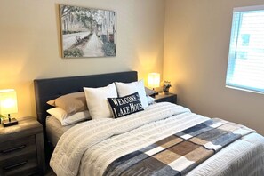 Two inviting bedrooms feature comfortable beds with plush pillows and warm blankets, creating a relaxing and welcoming atmosphere for your stay.