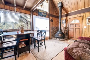 Dining area is connected to kitchen and living room, seats 4 comfortably.