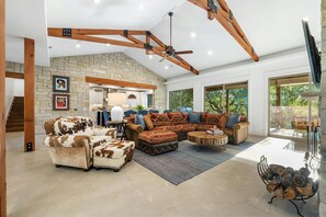 Great room with Leuders wood-burning fireplace and Anteks designer furnishings.