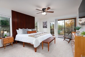The master bedroom sanctuary featuring a beautiful wood slat accent wall.