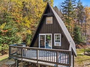 View of the house with the deck off the main floor. 