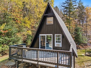 View of the house with the deck off the main floor.